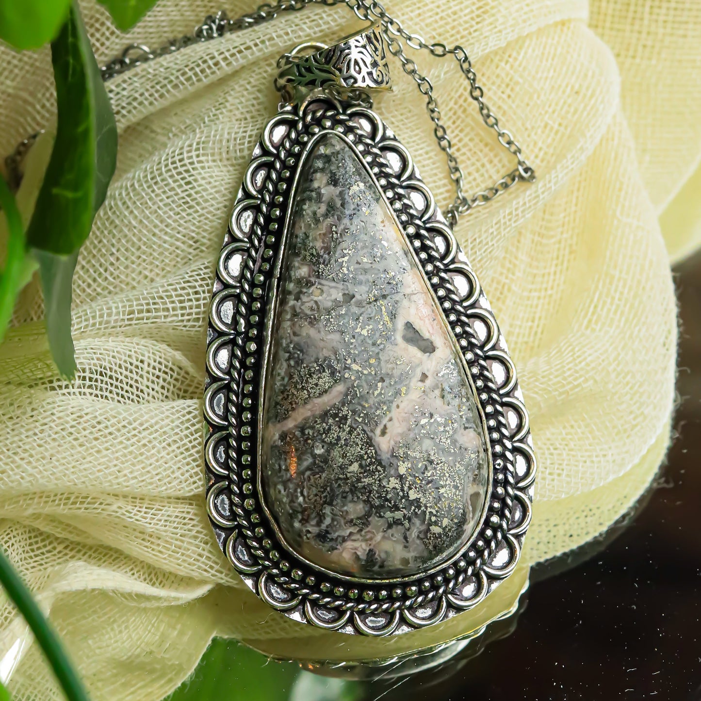 MantraMani® Rhodochrosite Crystal Pendant