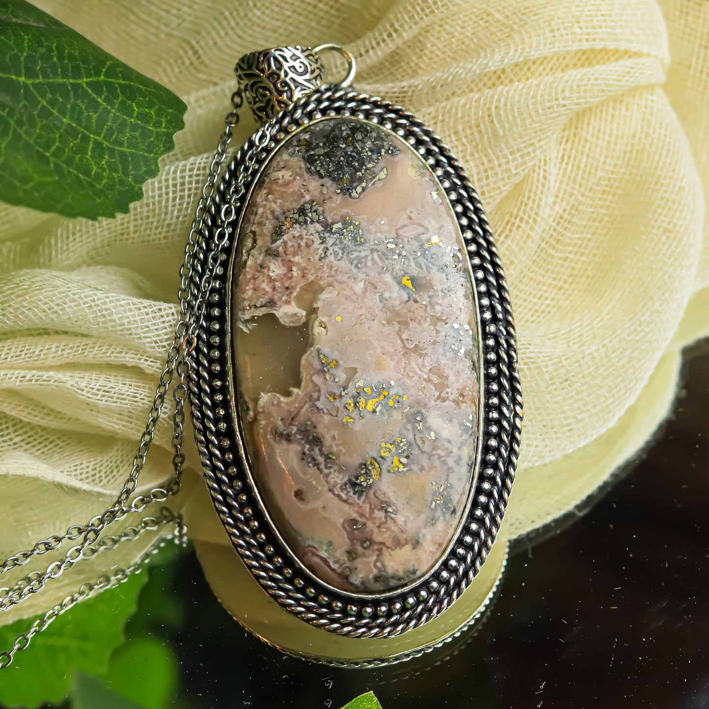 MantraMani® Rhodochrosite Crystal Pendant