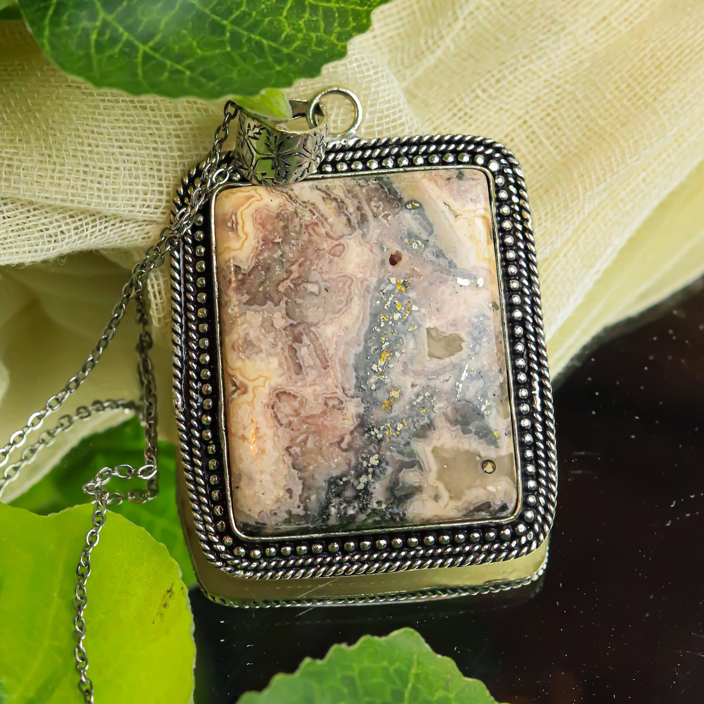 MantraMani® Rhodochrosite Crystal Pendant